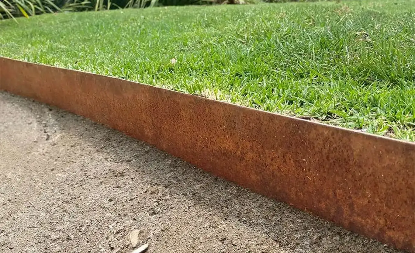 Weathered corten steel landscape edge showing its developed rust patina